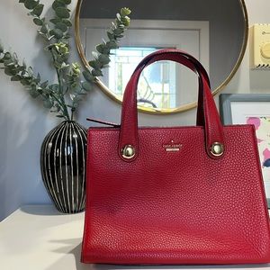 Red pebbled leather Kate Spade purse